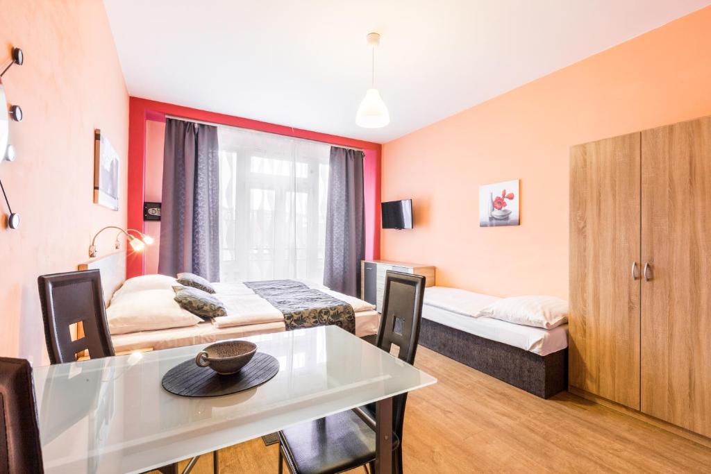 Postel nebo postele na pokoji v ubytování Rezidence Davids Apartments