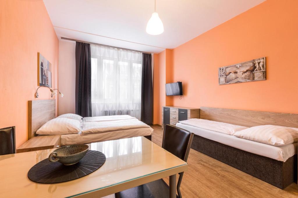 Postel nebo postele na pokoji v ubytování Rezidence Davids Apartments