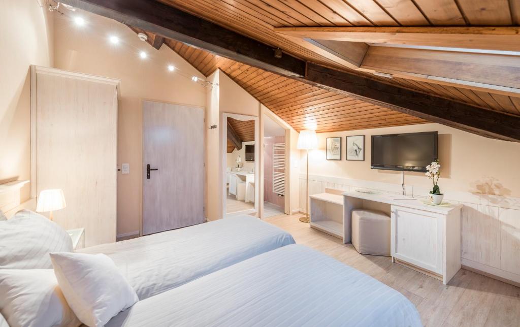 Letto o letti in una camera di Albergo Ristorante La Palma