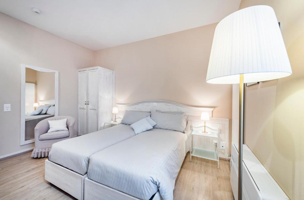 Letto o letti in una camera di Albergo Ristorante La Palma