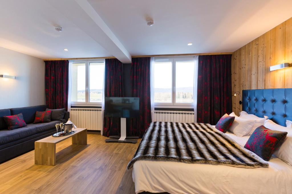 Postel nebo postele na pokoji v ubytování Hôtel restaurant Spa de l'Abbaye