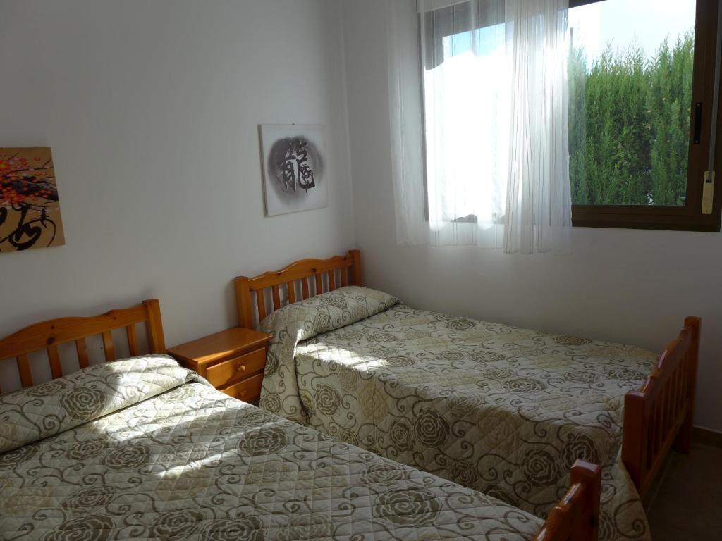 Postel nebo postele na pokoji v ubytování Rentalmar Villa California