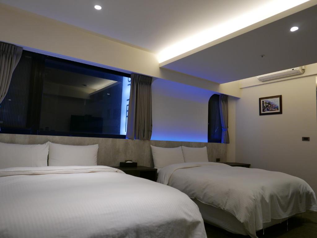 泊居旅店二館 Oursinn Hotel 2にあるベッド