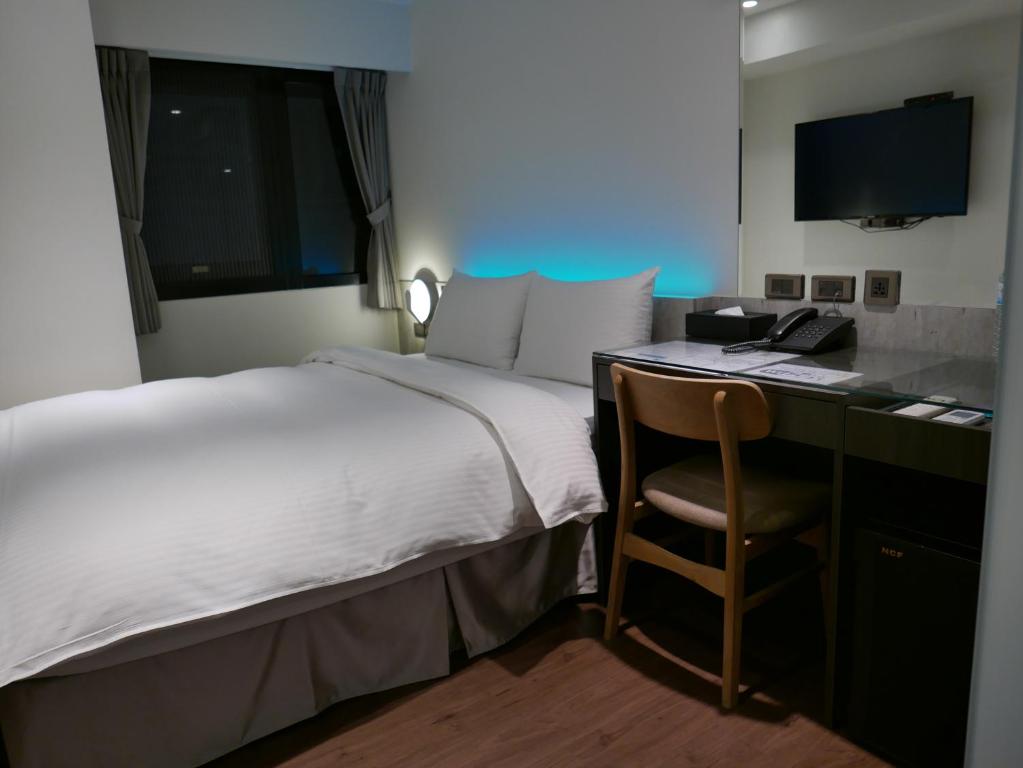 泊居旅店二館 Oursinn Hotel 2にあるベッド