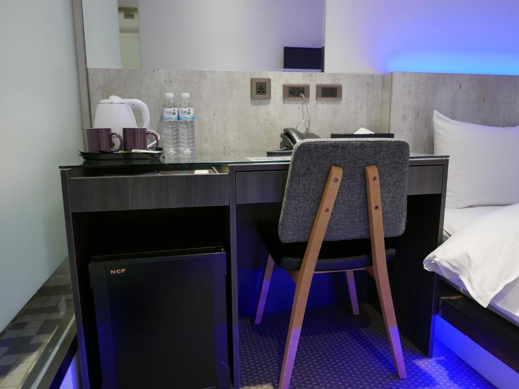 泊居旅店二館 Oursinn Hotel 2にあるベッド