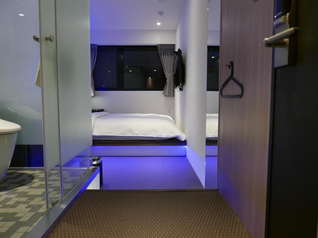 泊居旅店二館 Oursinn Hotel 2にあるベッド
