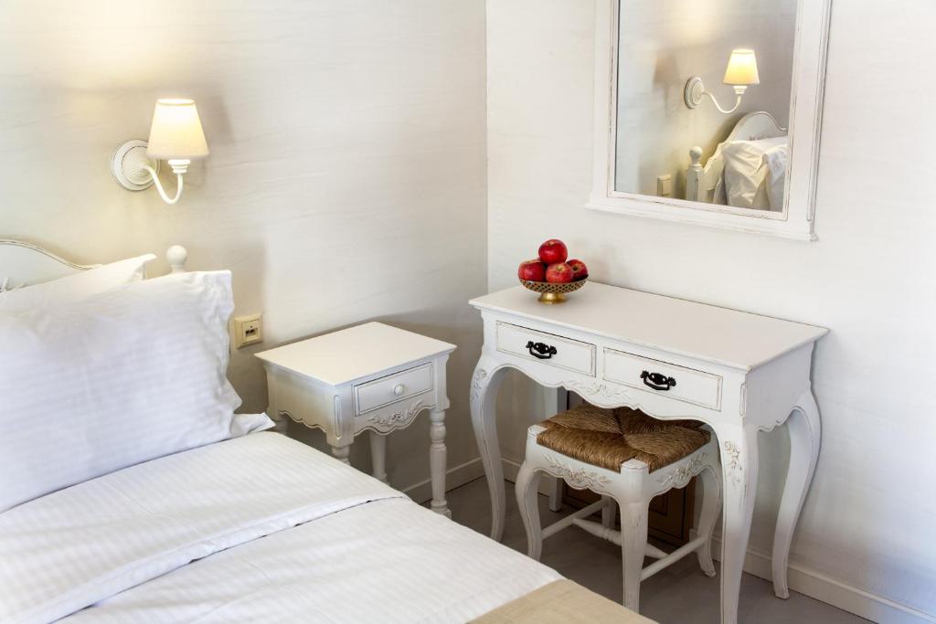 A bed or beds in a room at Haones Suites