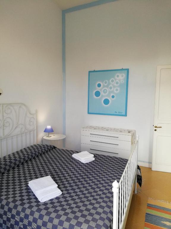 A bed or beds in a room at Il Giardino Del Purgatorio