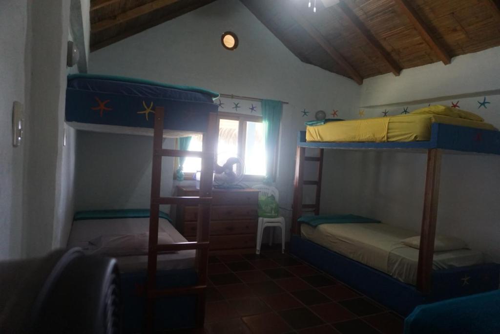 Postel nebo postele na pokoji v ubytování Hosteria Tsafiki