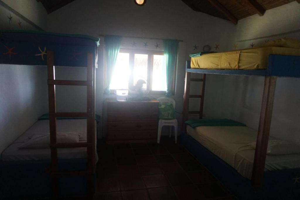 Postel nebo postele na pokoji v ubytování Hosteria Tsafiki
