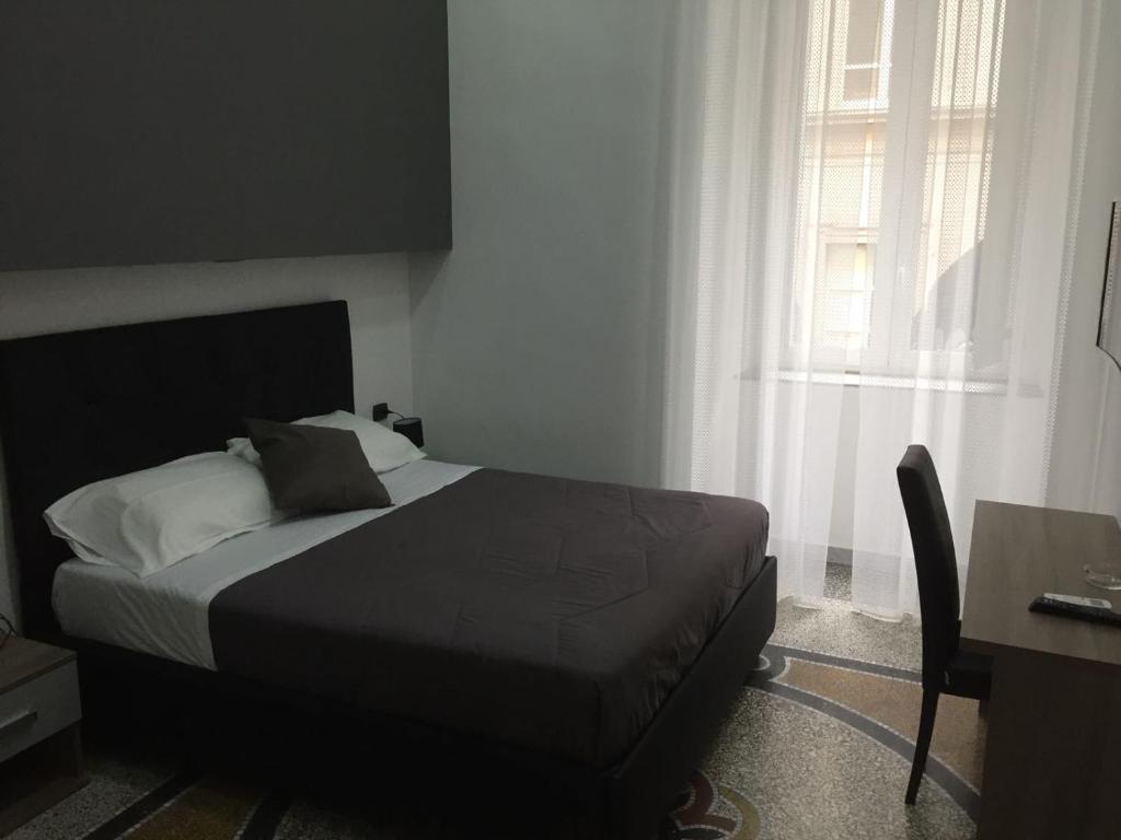 Letto o letti in una camera di MB95 - Mezzocannone Luxurious Bed&Breakfast