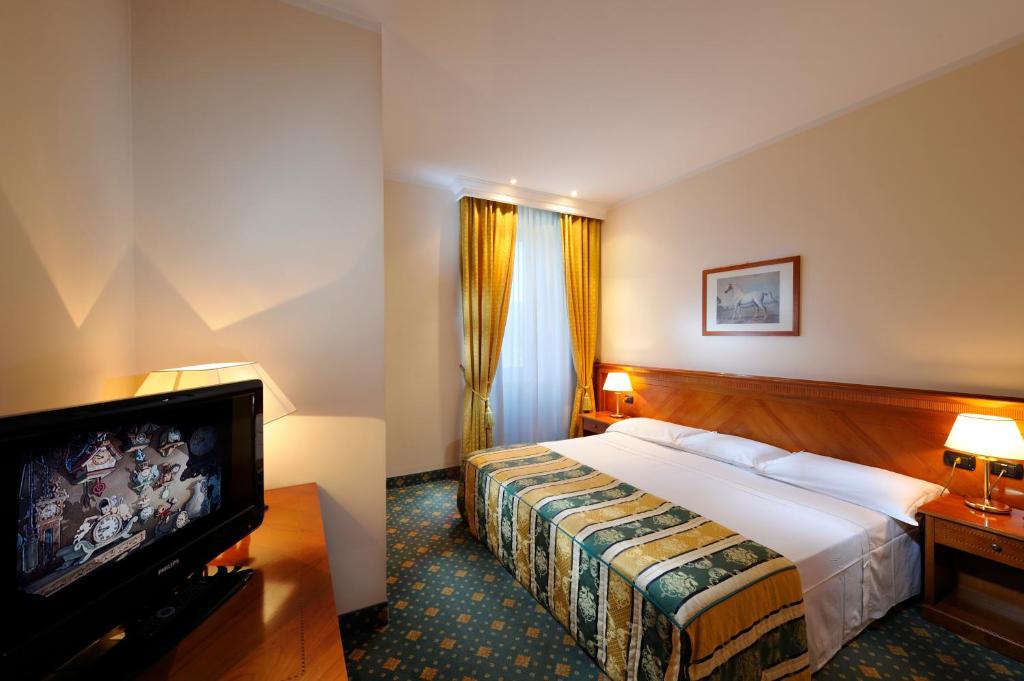 Postel nebo postele na pokoji v ubytování Hotel Eden