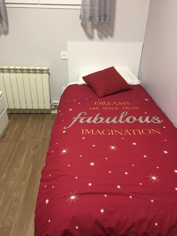 Postel nebo postele na pokoji v ubytování Apartamentos San Lázaro