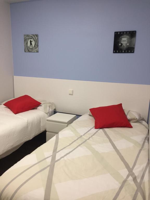 Postel nebo postele na pokoji v ubytování Apartamentos San Lázaro
