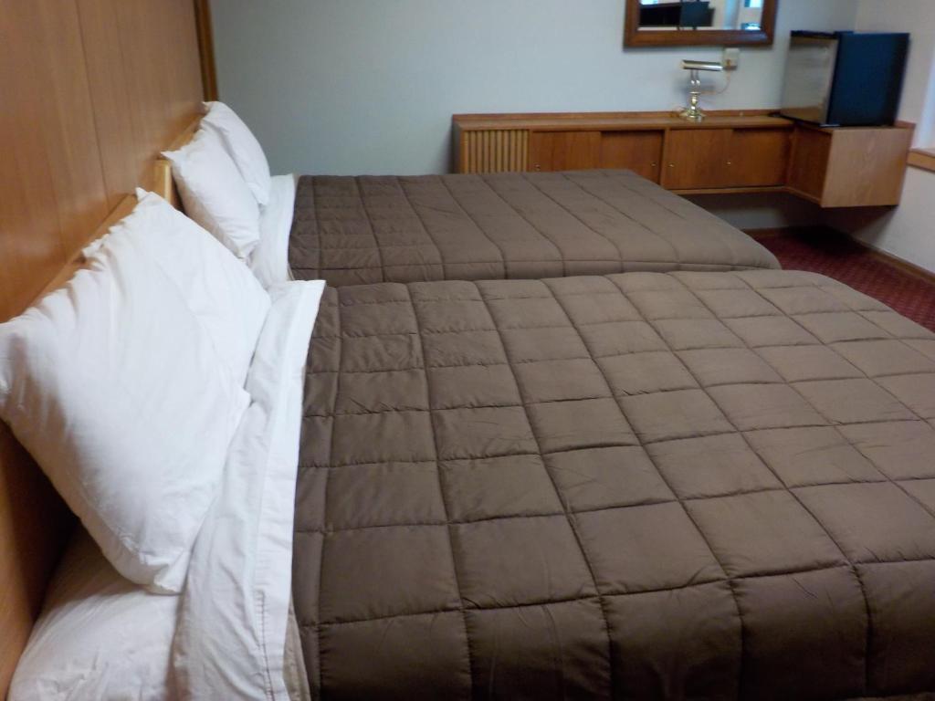 Postel nebo postele na pokoji v ubytování Vernon Hostel