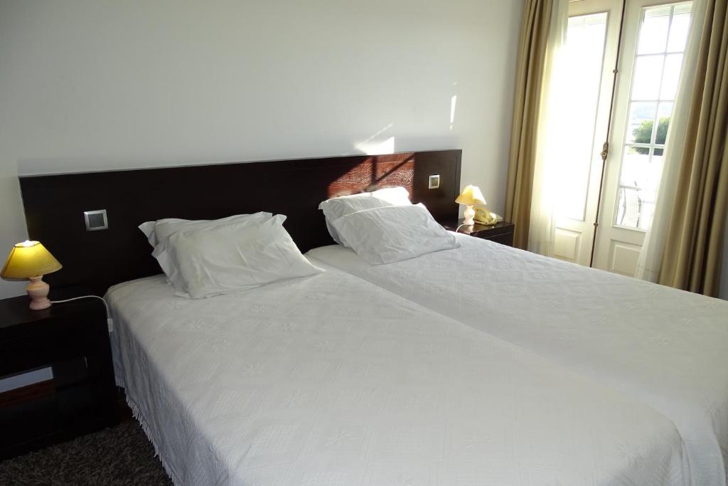 Postel nebo postele na pokoji v ubytování Hotel Mira Rio