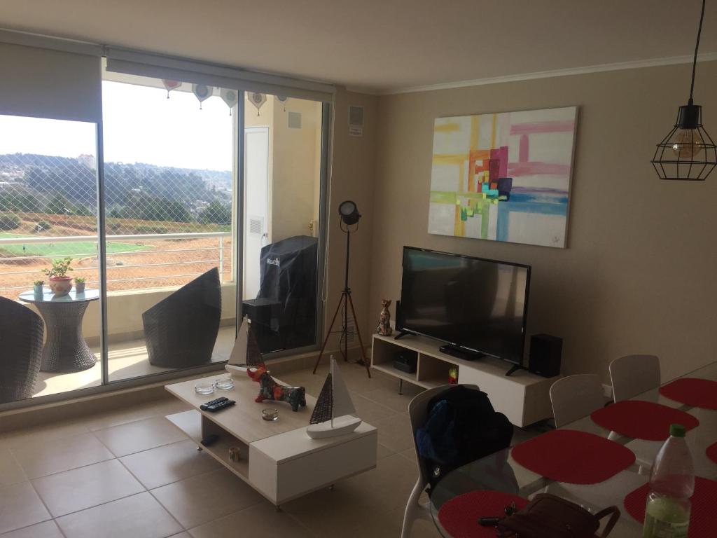 TV a/nebo společenská místnost v ubytování Laguna Bahia 711 Algarrobo