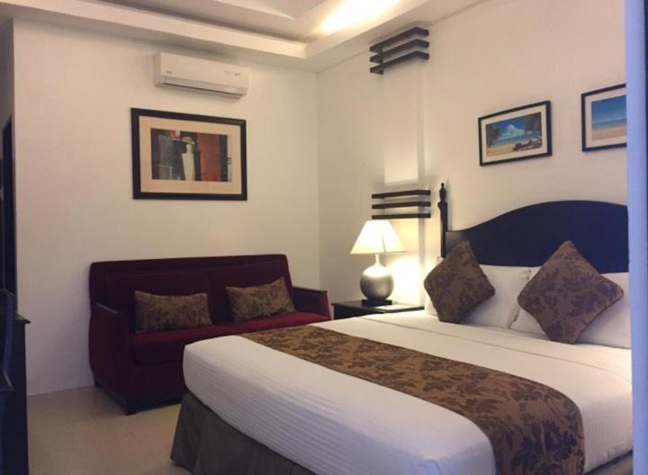 Postel nebo postele na pokoji v ubytování Chateau De Boracay