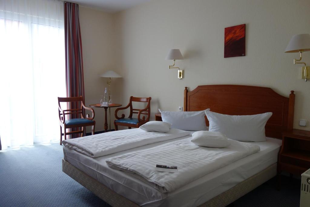 Postel nebo postele na pokoji v ubytování Mercure Hotel Plaza Magdeburg