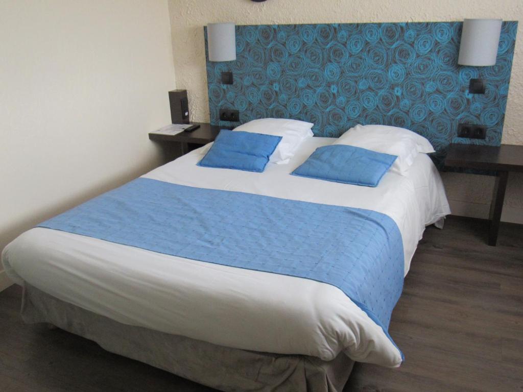 Postel nebo postele na pokoji v ubytování Citotel Les Sternes