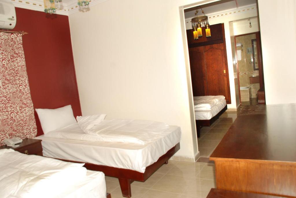 Postel nebo postele na pokoji v ubytování Philae Hotel Aswan