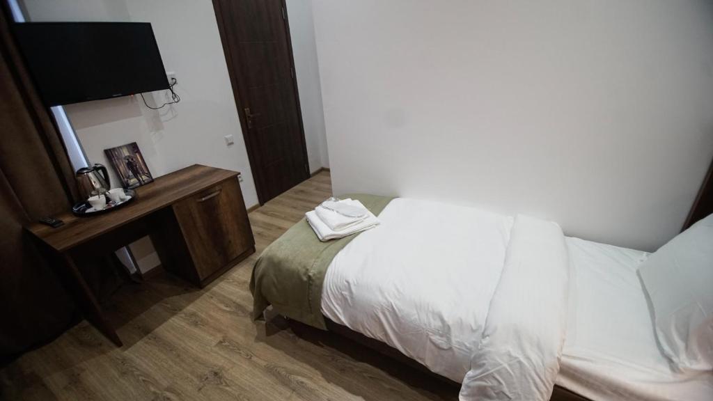 Postel nebo postele na pokoji v ubytování Hotel King Tom