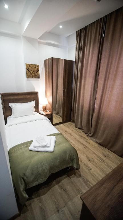 Postel nebo postele na pokoji v ubytování Hotel King Tom
