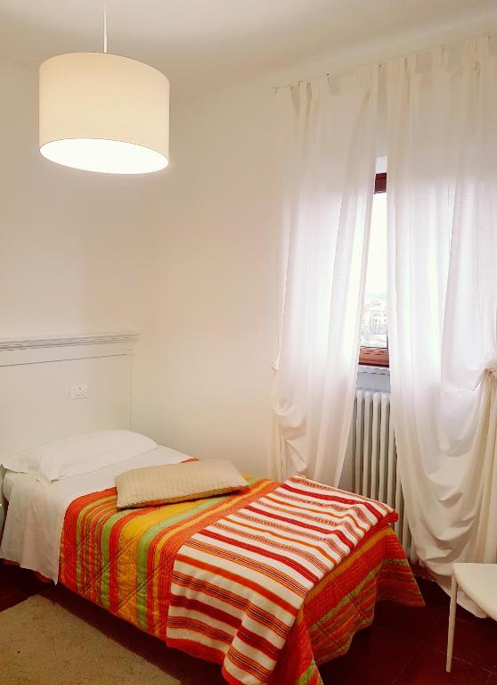 Postel nebo postele na pokoji v ubytování Hotel Porta Romana di Luce Hotels