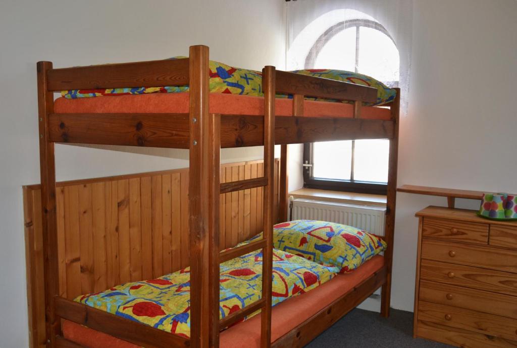 Postel nebo postele na pokoji v ubytování Penzion U Lípy