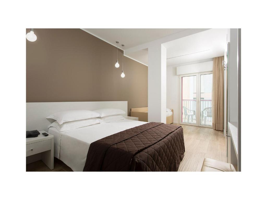 Postel nebo postele na pokoji v ubytování Hotel Gardenia