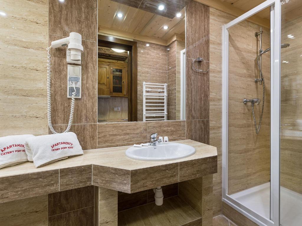 Kúpeľňa v ubytovaní Apartamenty z widokiem na Tatry Cztery Pory Roku