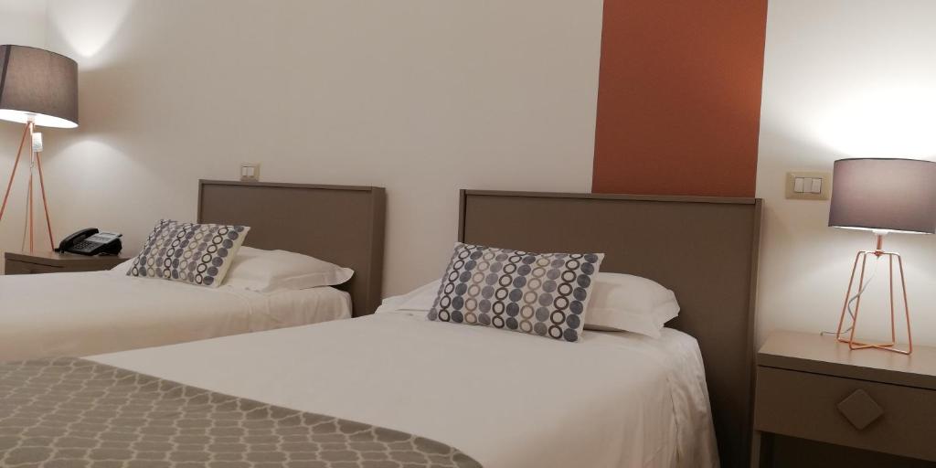 Postel nebo postele na pokoji v ubytování Villa Albina
