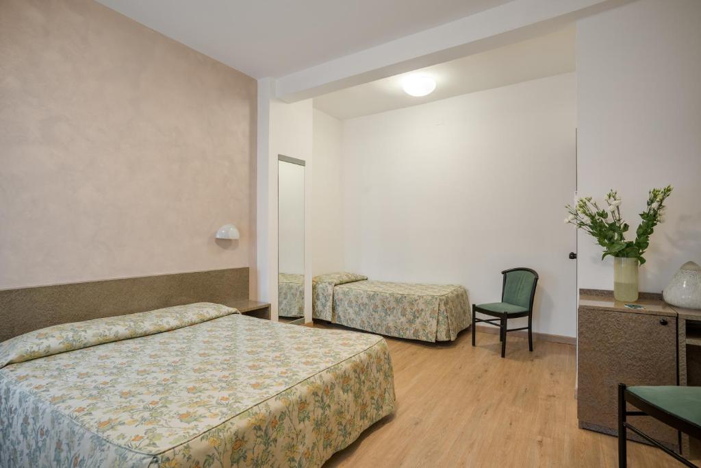 Postel nebo postele na pokoji v ubytování Hotel Garibaldi