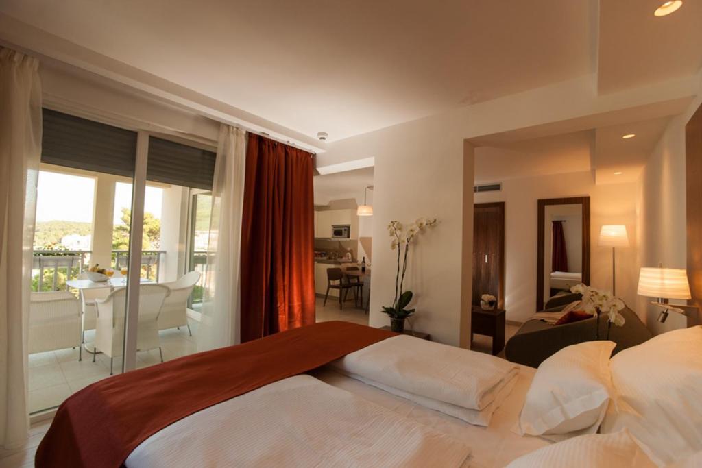 Posteľ alebo postele v izbe v ubytovaní Aparthotel Miramare