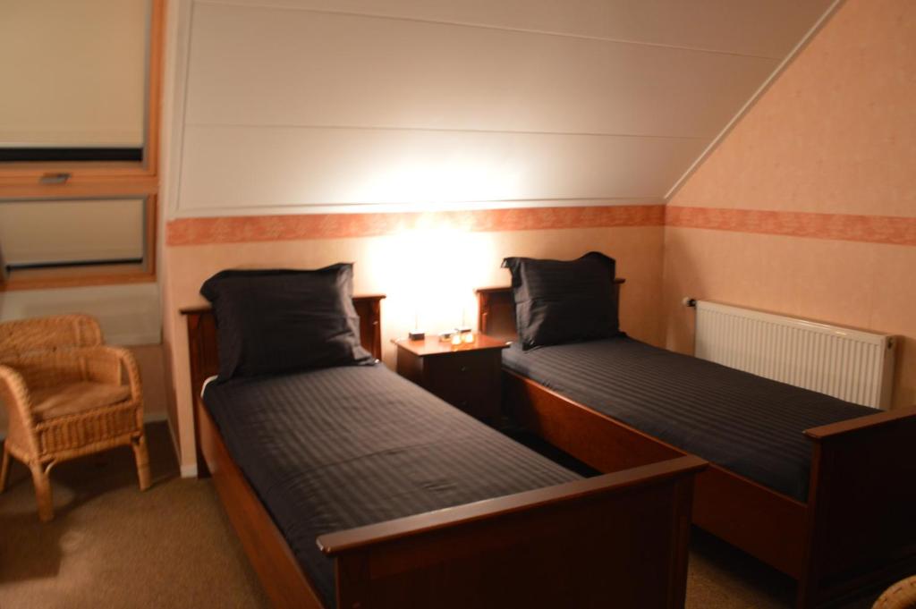Postel nebo postele na pokoji v ubytování Herberg Sellingen
