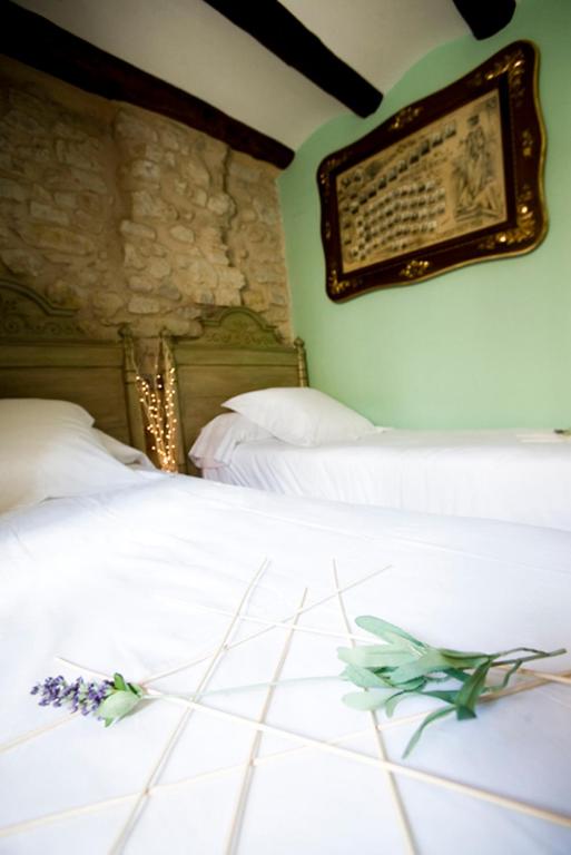 Cama o camas de una habitación en Apartamentos Doña Candida