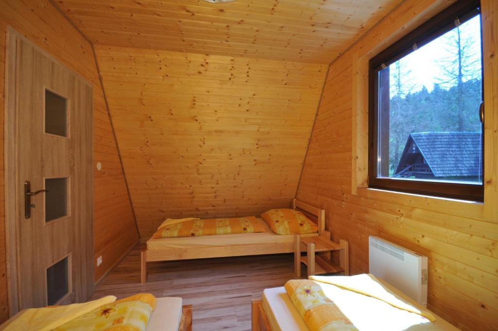 Postel nebo postele na pokoji v ubytování Autocamping Podlesok