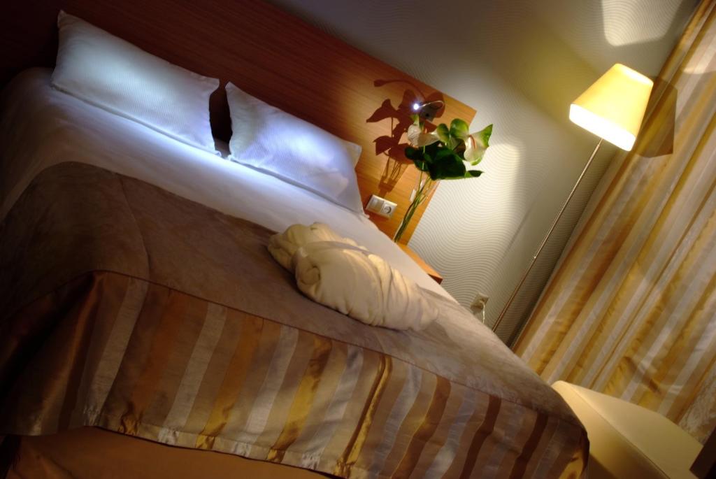 Posteľ alebo postele v izbe v ubytovaní Hotel HP Park Poznań Malta