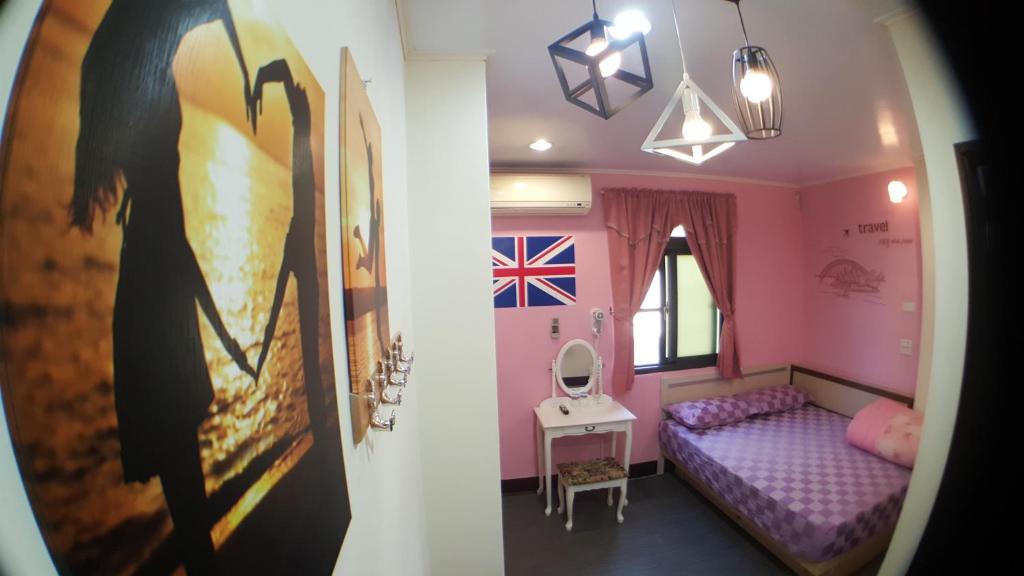 Postel nebo postele na pokoji v ubytování 龍園旅館Long Yuan Hotel