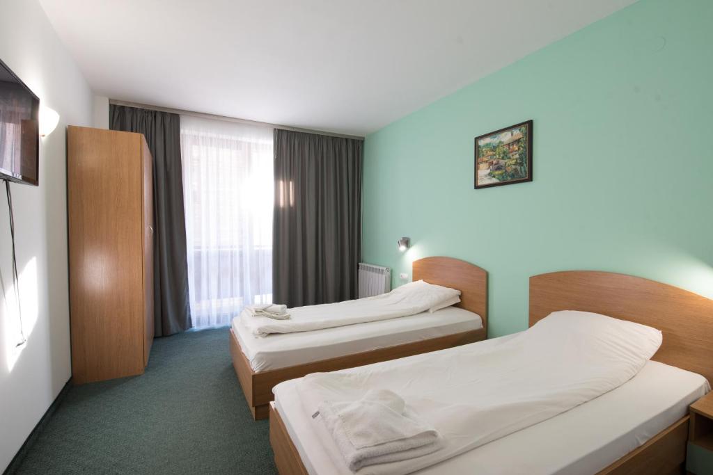 Postel nebo postele na pokoji v ubytování Hotel Iceberg Bansko