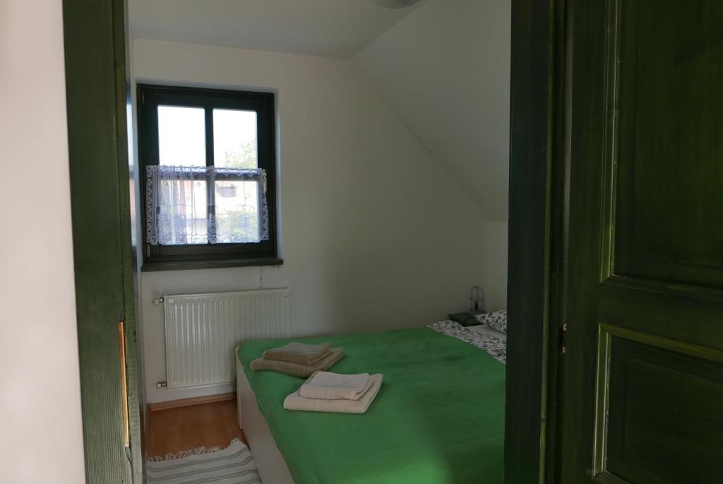 Postel nebo postele na pokoji v ubytování Hillside Apartments