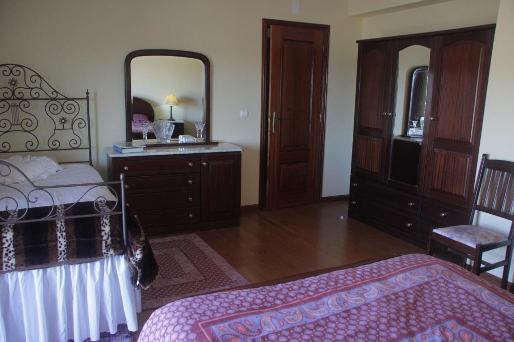 Uma cama ou camas num quarto em Quartos em vivenda serra da Estrela