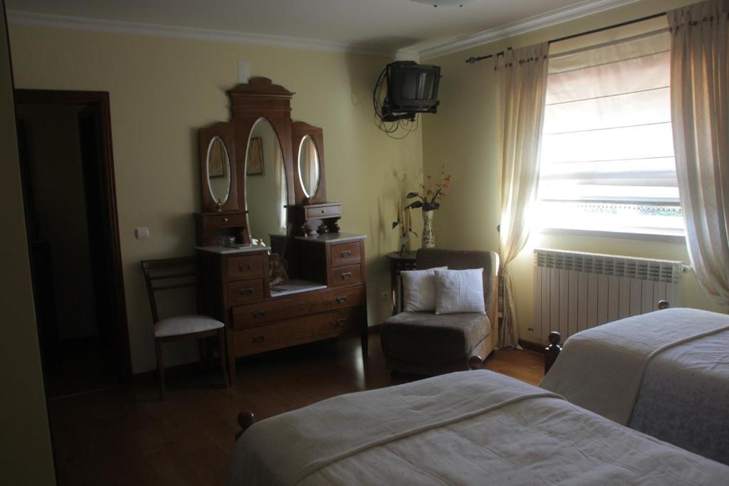 Uma cama ou camas num quarto em Quartos em vivenda serra da Estrela