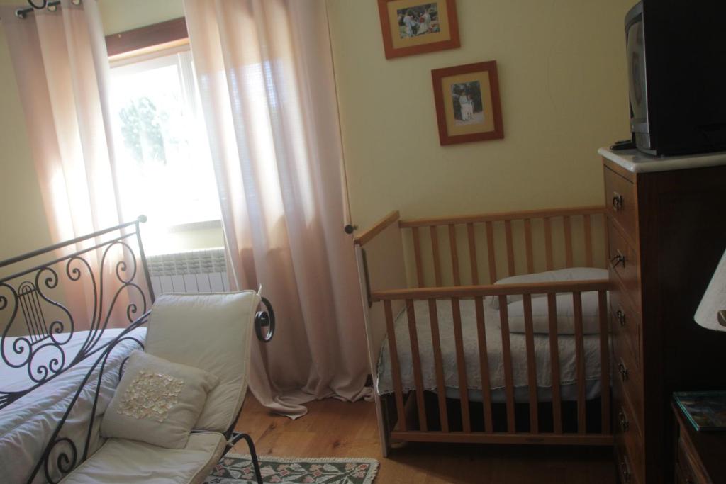 Uma cama ou camas num quarto em Quartos em vivenda serra da Estrela
