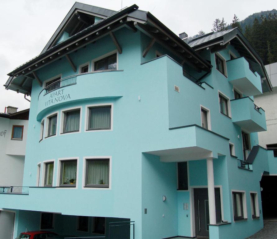 a blue building with the name of the hotel at Apart Vita Nova in Ischgl