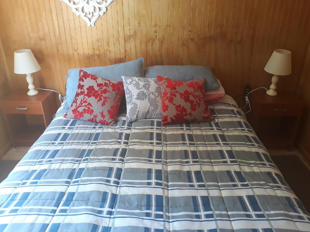 Voodi või voodid majutusasutuse Cabañas & Hostal Lefuco toas