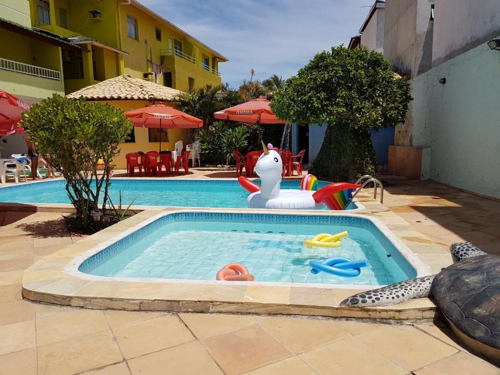 Bazén v ubytování Hotel Pousada Oasis nebo v jeho okolí