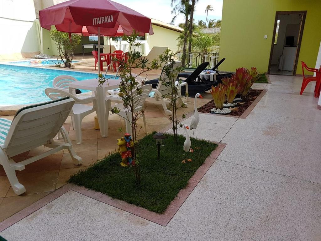 Bazén v ubytování Hotel Pousada Oasis nebo v jeho okolí
