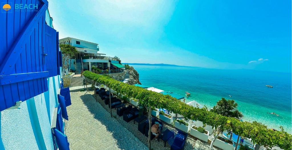 a view of the ocean from the balcony of a hotel at Beach Hotel in Drasnice