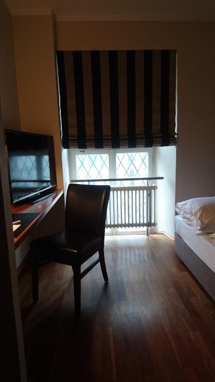 Postel nebo postele na pokoji v ubytování Hotel Kaiserhof am Dom